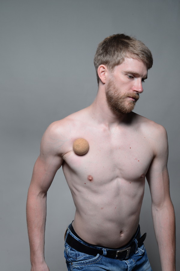 Doing a self-massage of the Pectoralis minor with a ball and the Trigger Fa...